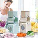 Manual rotary vegetable graters and slicers